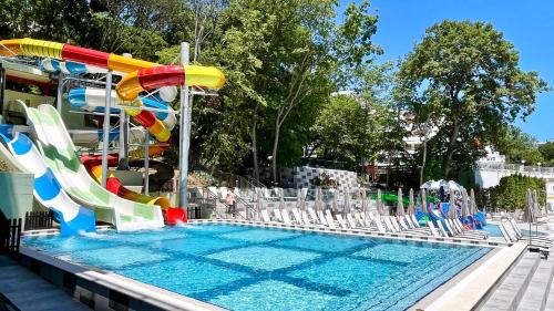 a swimming pool with a water slide and a water park at BSA Gradina Hotel & Aquapark - All Inclusive in Golden Sands
