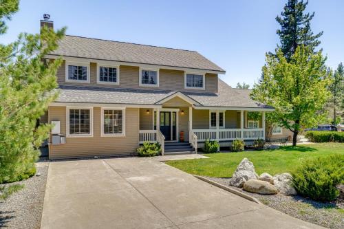 a yellow house with a driveway in front of it at Private Hot Tub Spacious Family Home in Truckee! in Truckee