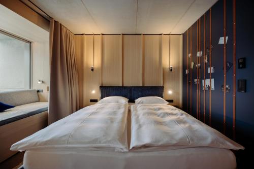 Una cama o camas en una habitación de Dips&Drops - Hotel Superior