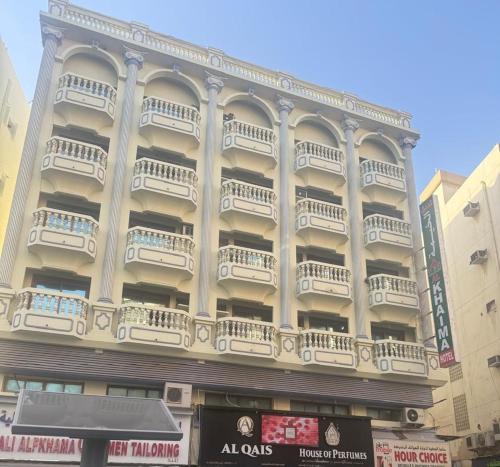 a large building with balconies on the side of it at Al Khaima Hotel in Dubai