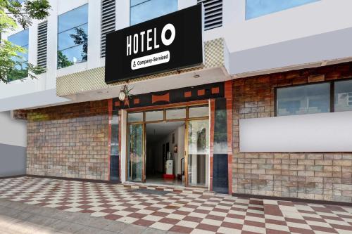 a hotel entrance with a sign on a building at Hotel O Jagadamba Junction in Visakhapatnam