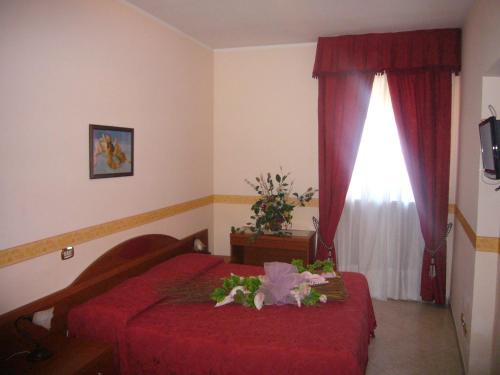 Postel nebo postele na pokoji v ubytování Villa Altieri