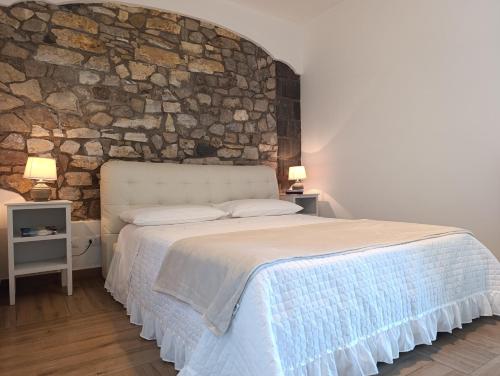 Un pat sau paturi într-o cameră la Casa Limoncella a Sant' Agata sui due Golfi