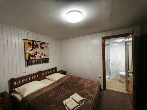 Postel nebo postele na pokoji v ubytování At Starunchakiv family
