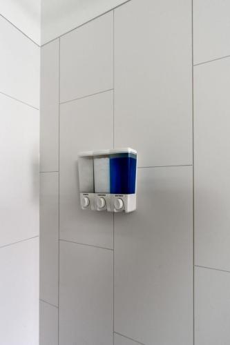 a blue and silver object on a white wall at Stunning 3-Bed Retreat in the Heart of Downtown in Spokane