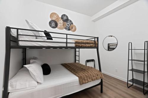 a bedroom with two bunk beds in a room at Stunning 3-Bed Retreat in the Heart of Downtown in Spokane