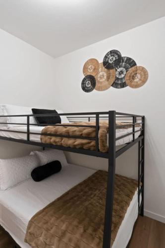 a couple of bunk beds in a room at Stunning 3-Bed Retreat in the Heart of Downtown in Spokane