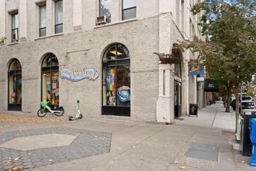 a scooter parked outside of a store on a city street at Stunning 3-Bed Retreat in the Heart of Downtown in Spokane