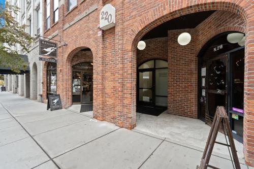 a brick building with arches on a city street at Modern Luxury - 3 Bed in the Heart of Downtown in Spokane