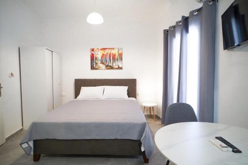 A bed or beds in a room at Old Town Studios, Corfu