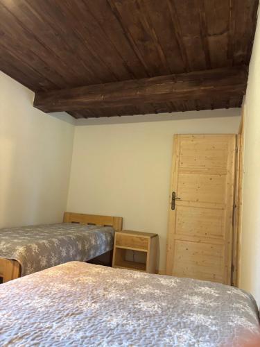 Postel nebo postele na pokoji v ubytování Švajkova chyža