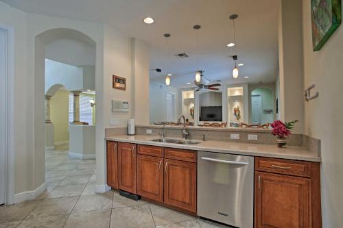 a kitchen with a sink and a large mirror at jupiterholidays in Jupiter