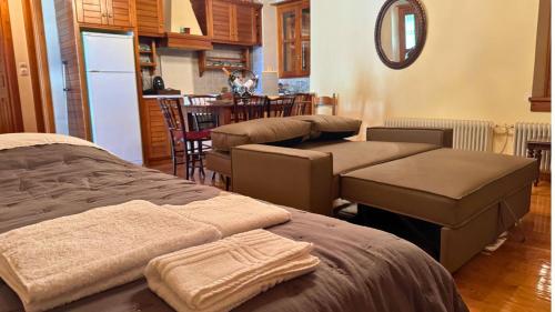 a massage room with two beds and a kitchen at Trypinest in Sparti
