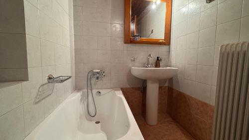 a bathroom with a sink and a bath tub and a sink at Trypinest in Sparti