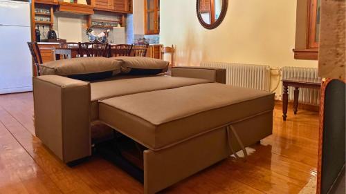 a couple of ottomans in a living room at Trypinest in Sparti