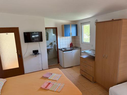 Kuchyň nebo kuchyňský kout v ubytování Apartments Vretenicic