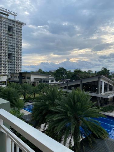 a view from the balcony of a resort with palm trees at Condominium Luxury 1 bedroom, impressive amenities in Davao City