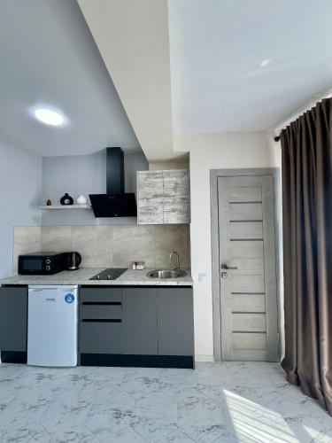 a kitchen with a sink and a counter top at apartments in Ternopil city in Ternopilʼ
