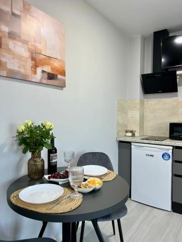 a kitchen with a table with plates of food on it at apartments in Ternopil city in Ternopilʼ