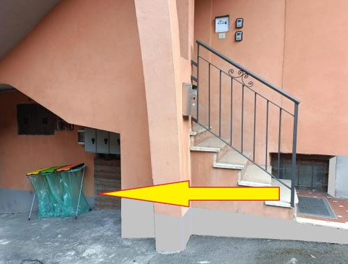 a building with a stair railing with a tent next to it at 20 VENTI in Angolo Terme