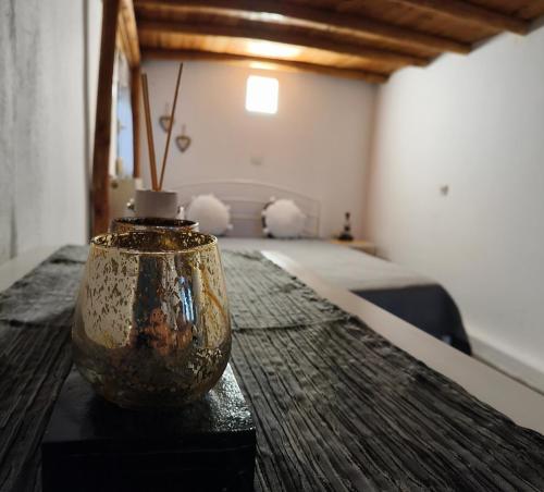a vase sitting on top of a table in a room at The chill spot in Tagarades