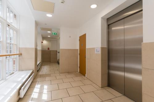 a hallway with doors and stalls in a building at In the middle of Cardiff City centre in Cardiff