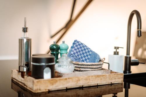 a wooden crate with items on top of a table at Little Farm Comfort&PrestigeHouse in Ittre