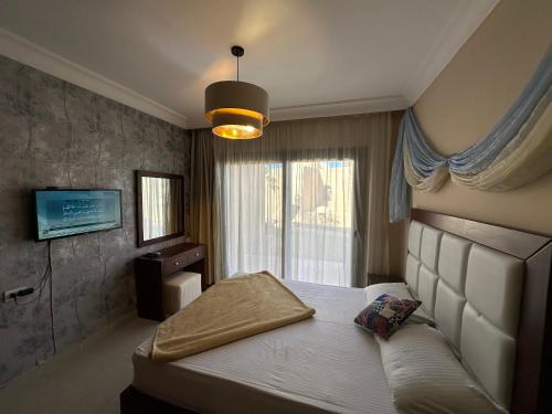 Katil atau katil-katil dalam bilik di The Nubian Two-Bedroom Apartment