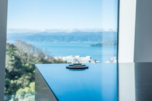 a close up of a table with a view of the water at Luxury Wellington Accomodation in Wellington