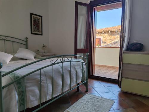 Ένα ή περισσότερα κρεβάτια σε δωμάτιο στο Villa Fra San Teodoro Lu Fraili