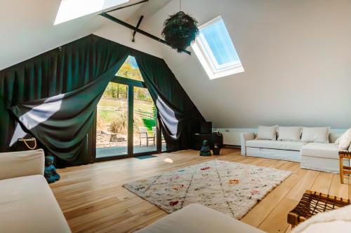 a living room with a couch and a rug at Little Farm Comfort&PrestigeHouse in Ittre