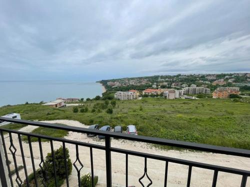 a view of a beach from a balcony at Fortuna Cape 4 apartment in Byala