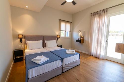 Postel nebo postele na pokoji v ubytování Elysium Exclusive Villas