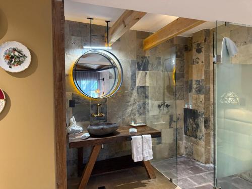 a bathroom with a sink and a mirror at Hotel Boutique Casa Laja in San Miguel de Allende