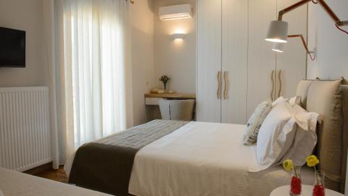 Ένα ή περισσότερα κρεβάτια σε δωμάτιο στο Gatzea Villas