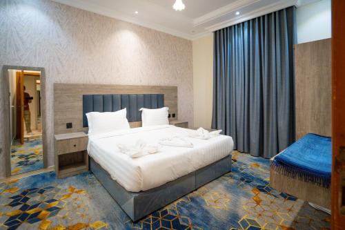 Letto o letti in una camera di روز سيتي للشقق المخدومة