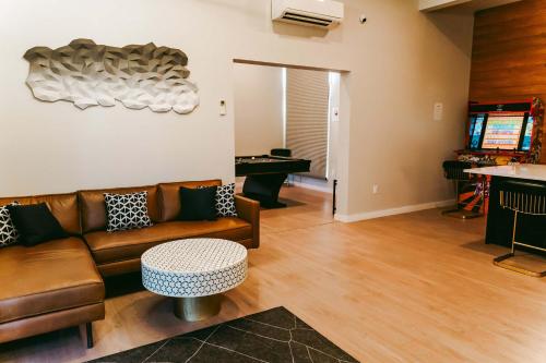 a living room with a couch and a table at Stardust Big Bend Luxury A-Frame#10 with a fab view in Terlingua