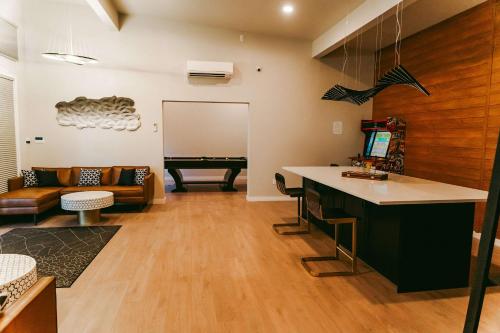 a living room with a couch and a pool table at Stardust Big Bend Luxury A-Frame#10 with a fab view in Terlingua