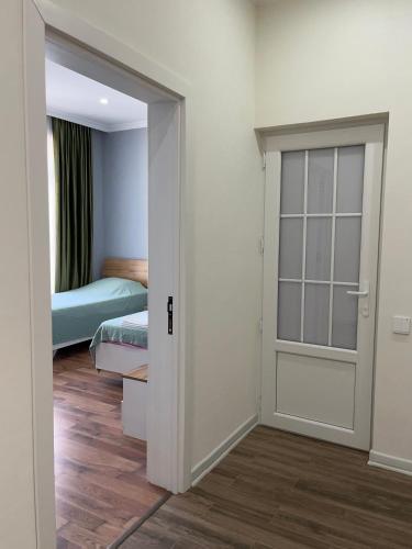 a room with a door leading to a bedroom at Vəndam villas in Vǝndam