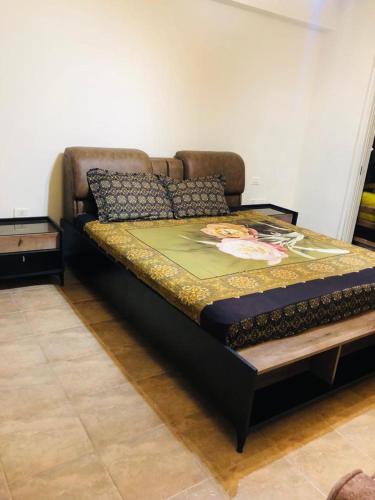 a large bed in a room with avertisement at العين السخنة in Ain Sokhna