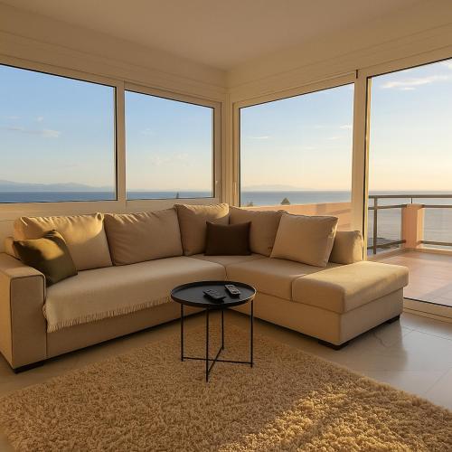 a living room with a couch and a table at GP Castle Patras in Patra