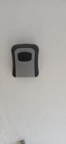 a black and white object on a white ceiling at Entire 3 bedroom house in St Thomas, Jamaica in Port Morant