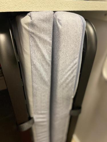 a stack of white towels hanging on a shelf at Sea-Inspired Suite for You and Your Pet in Öjersjö