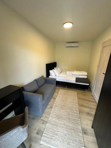 En eller flere senge i et værelse på Zona 57 Apartamenty Okuninka