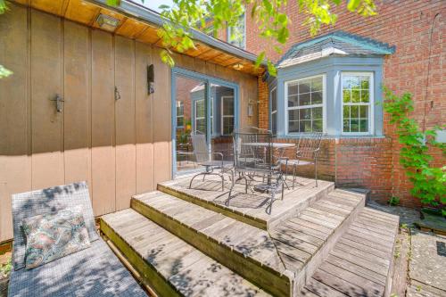 a patio with a table and chairs on it at Historic University Heights Home with Private Yard! in University Heights