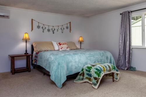 a bedroom with a large bed and a window at Peak View | White Pass, Mt Rainier in Packwood