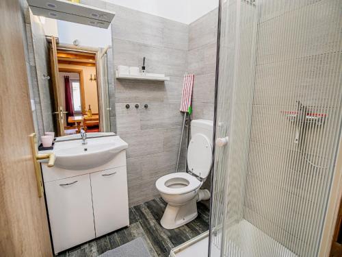 a bathroom with a toilet and a sink and a shower at Sleek and Stylish Umag Apartments with Sea View - Comfort Two Bedroom Apartment with Terrace in Umag
