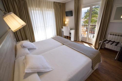 Кровать или кровати в номере Hotel Don Pepe