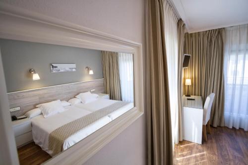 Кровать или кровати в номере Hotel Don Pepe