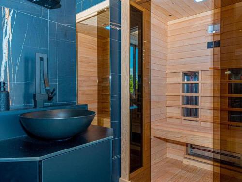 a bathroom with a bowl sink and a shower at Four Bedroom Villa with pool in Vodice